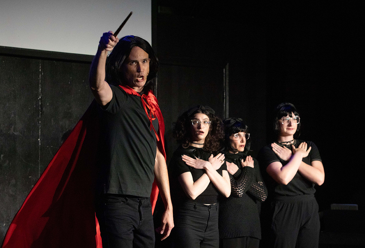 Cast members performing on stage